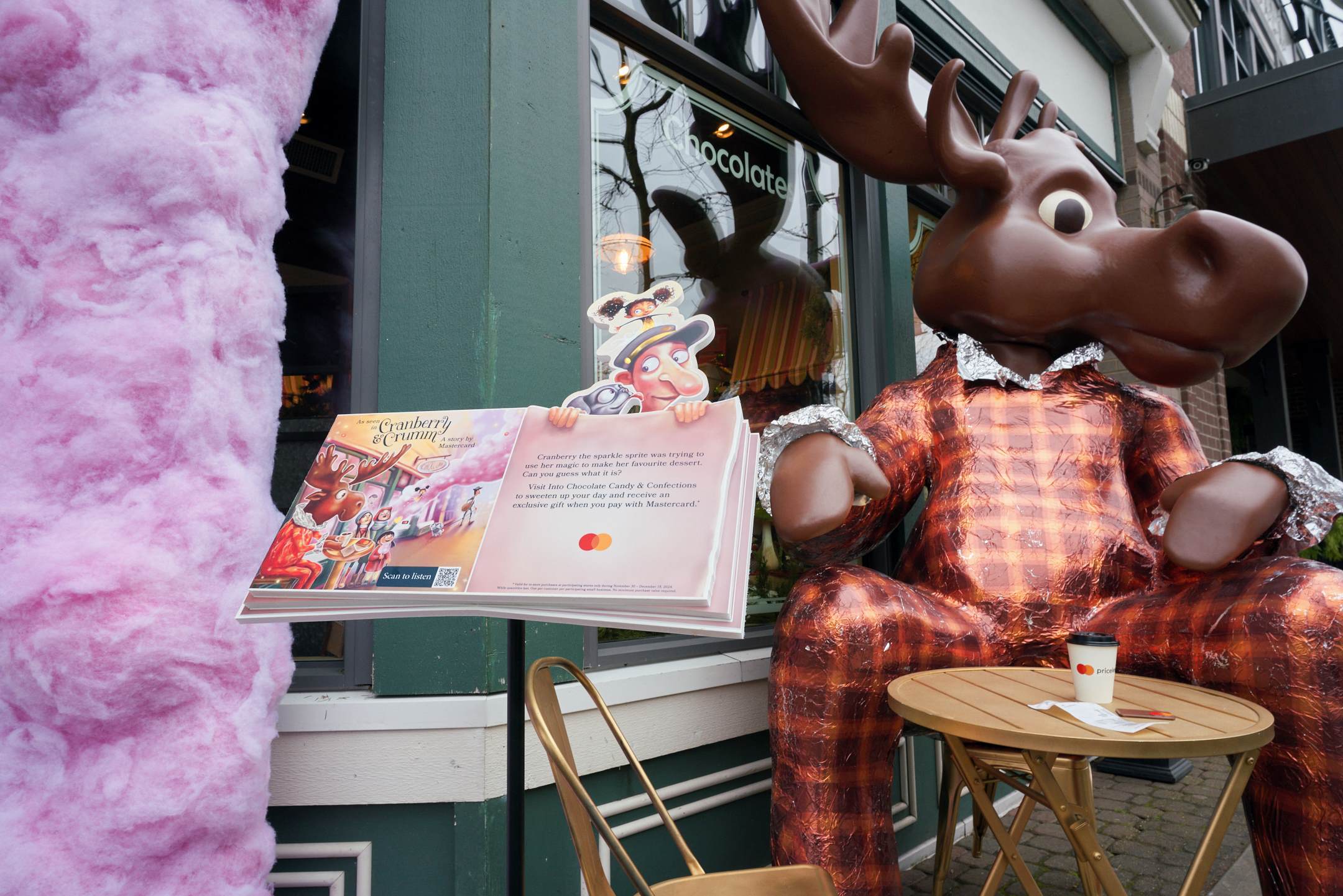 A sculpture of a moose in a suit sits outside a chocolate shop in Fort Langley, B.C.