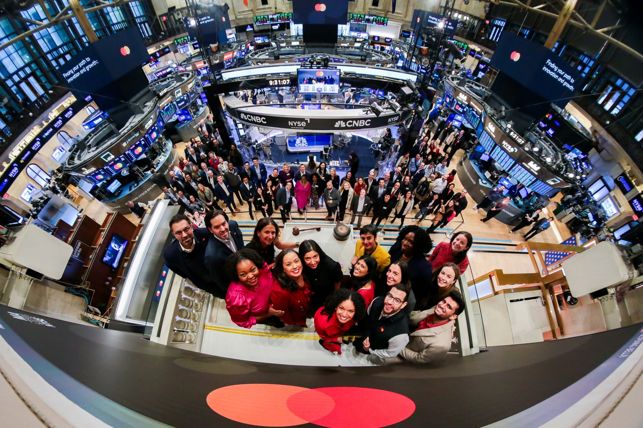 Mastercard Start Path leaders and other employees ring the bell at the New York Stock Exchange. 